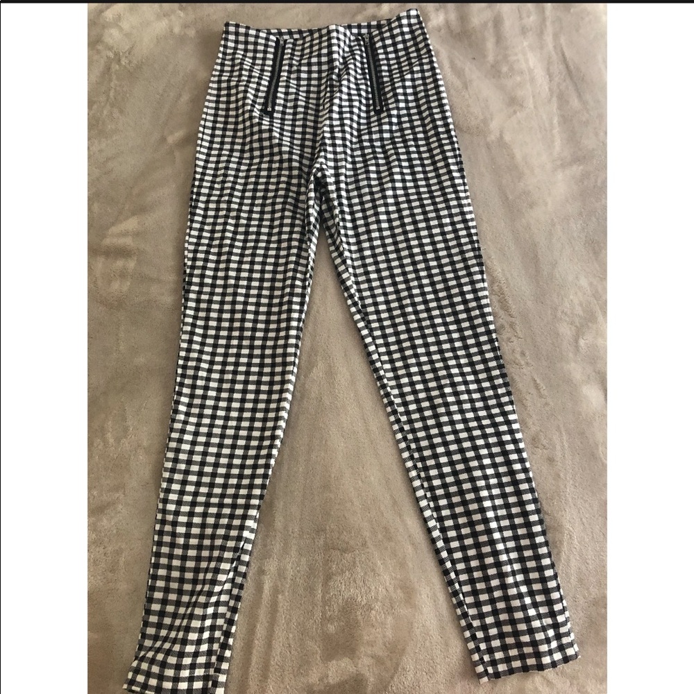 Black and white plaid pants with zipper detail